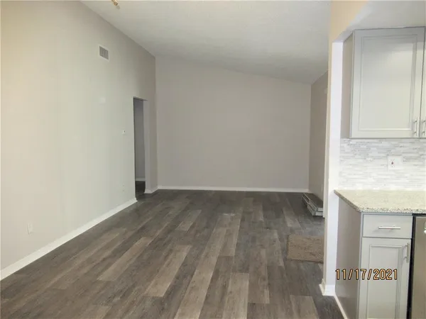 a view of kitchen with wooden floor