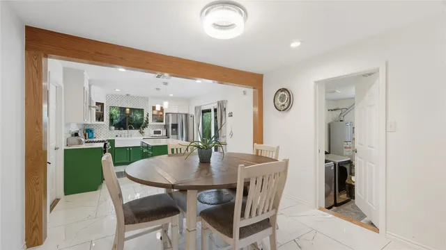 a view of a livingroom with furniture and a flat screen tv