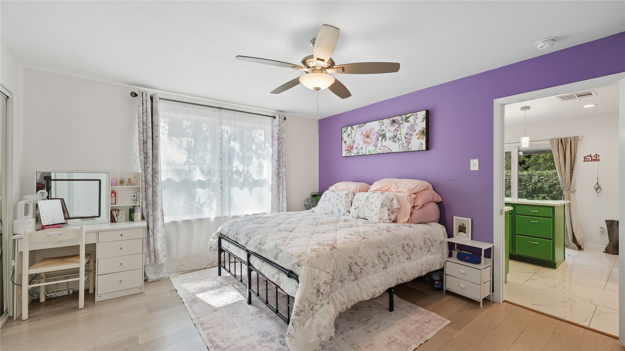 6503 Lynch Lane Austin, TX 78741 - Photo 17 of 38 a bedroom with a bed and a chandelier