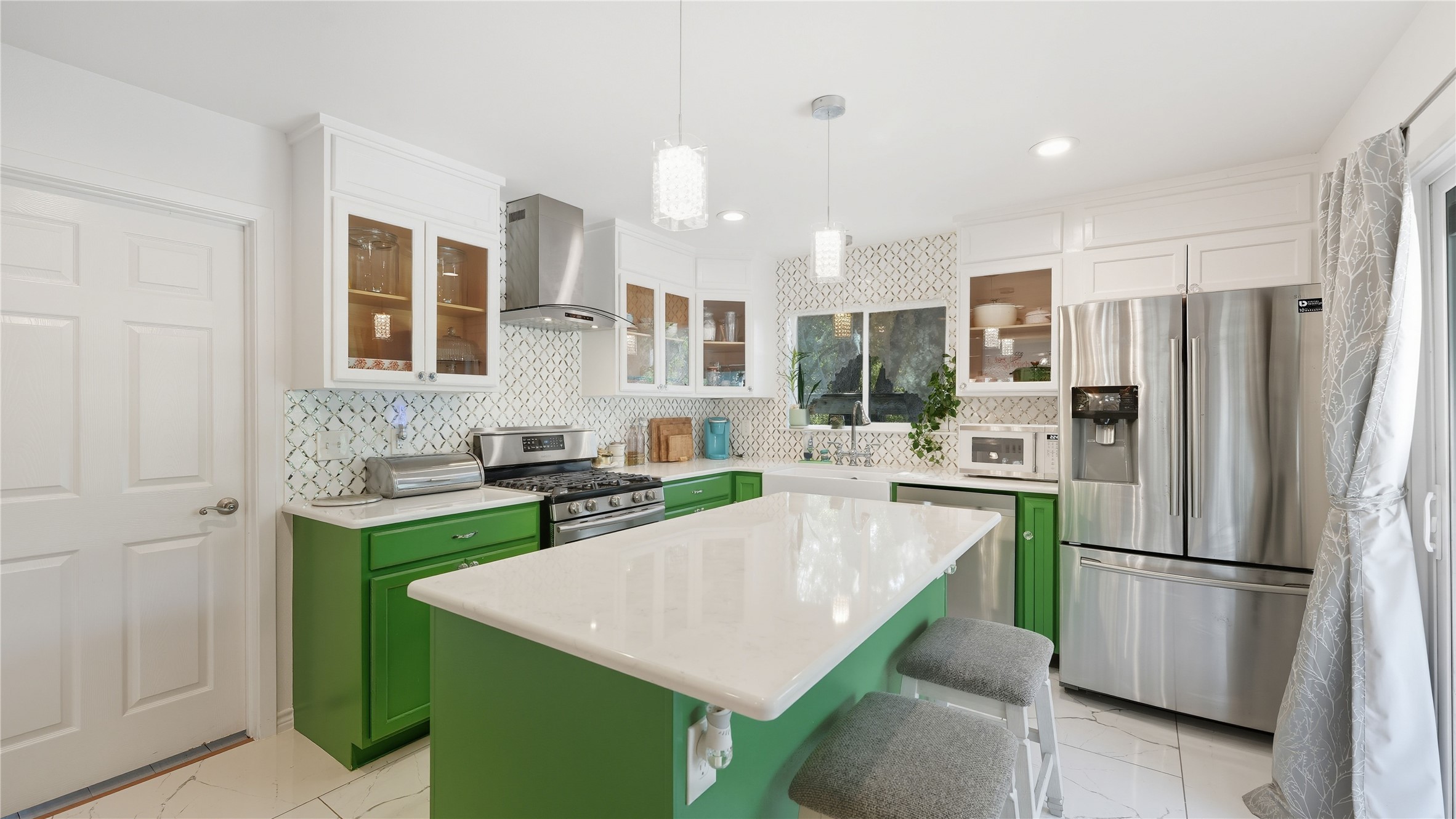 6503 Lynch Lane Austin, TX 78741 - Photo 2 of 38 a kitchen with a refrigerator a stove top oven a sink and cabinets