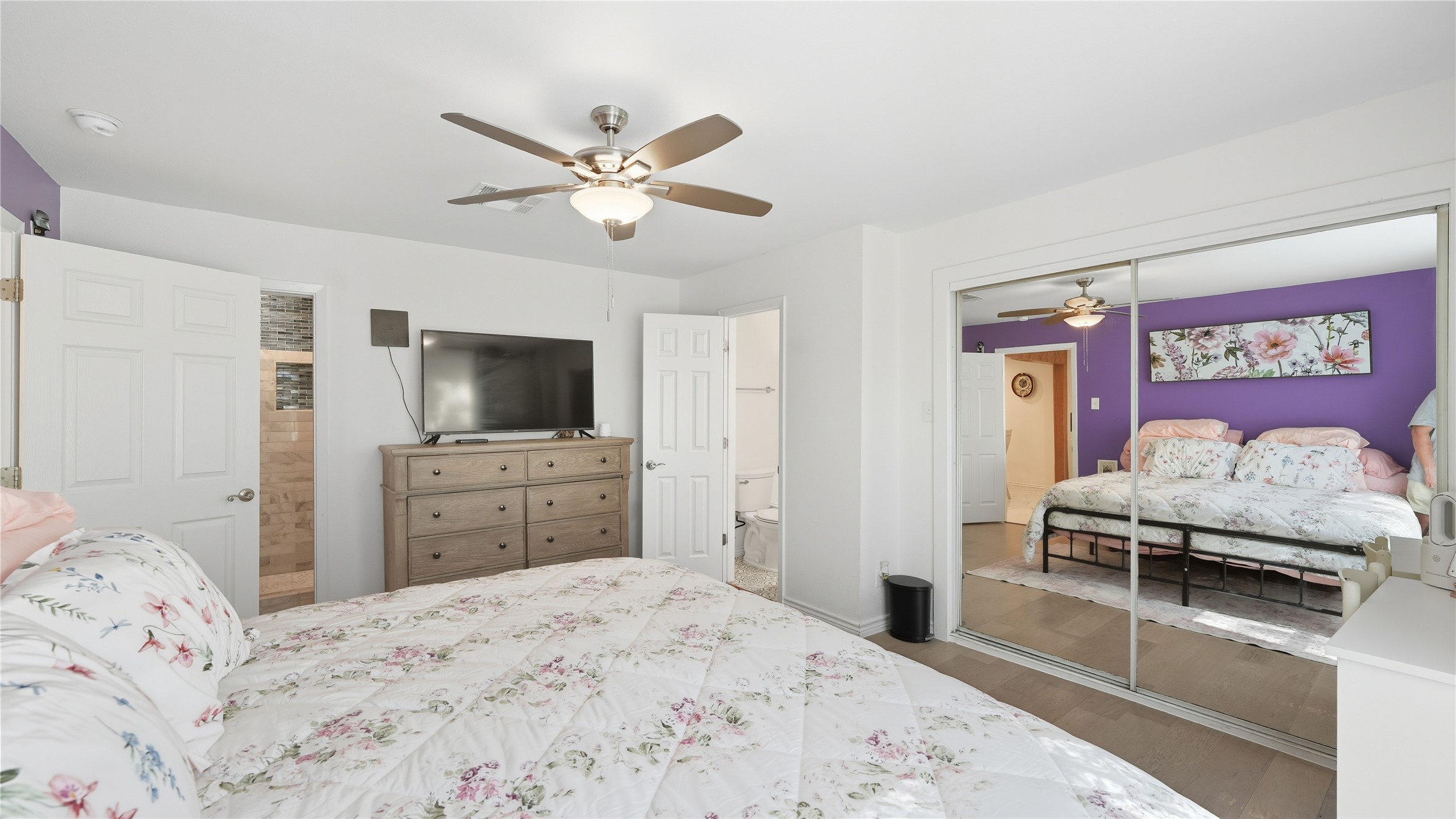 6503 Lynch Lane Austin, TX 78741 - Photo 20 of 38 a bedroom with a bed and a flat screen tv