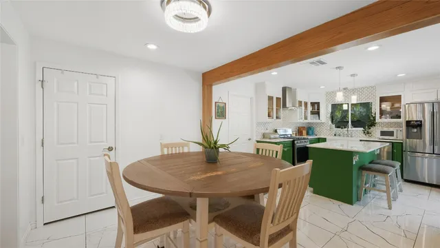 a view of a livingroom with furniture and a flat screen tv