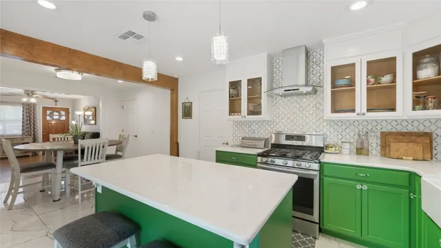 a kitchen with lots of counter top space and stainless steel appliances