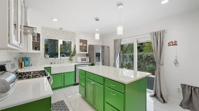 a kitchen with a table and chairs in it