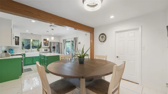 a kitchen with a table and chairs