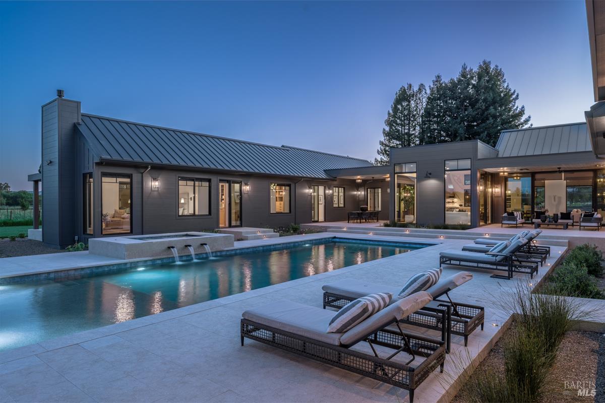 601 Napa Road Sonoma, CA 95476 - Photo 11 of 14 a view of a patio with lawn chairs wooden floor and fence