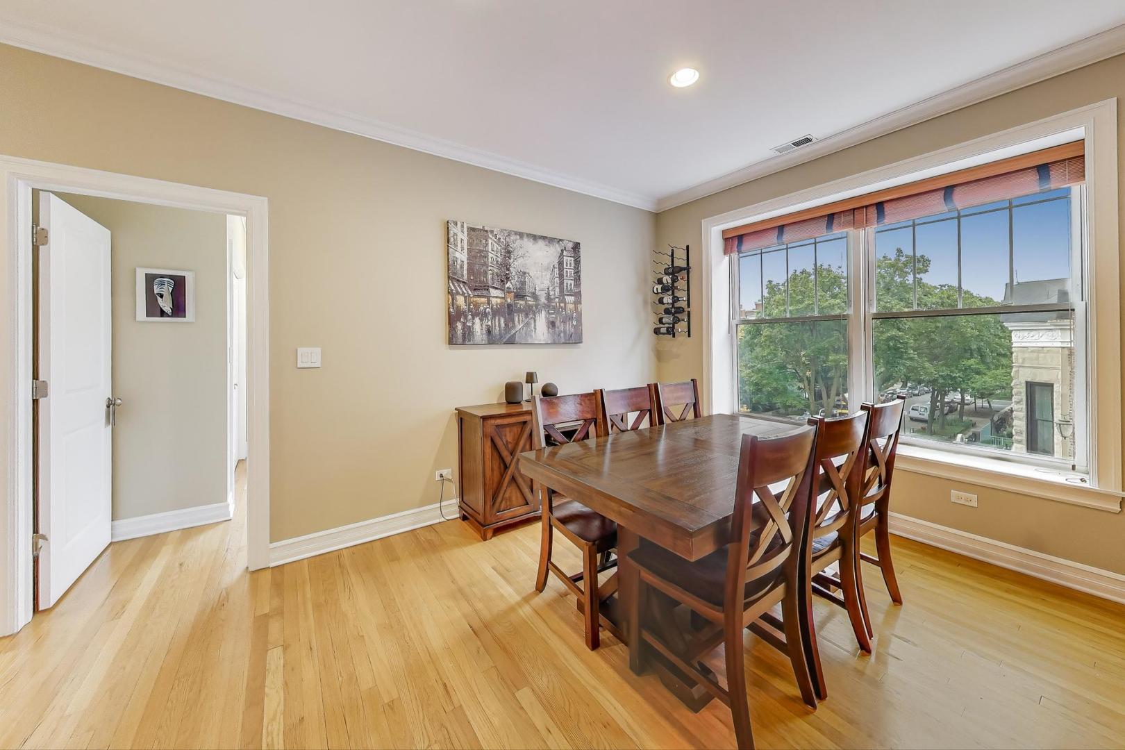 2711 North Mildred Avenue, Unit 3A Chicago, IL 60614 - Photo 11 of 27 a dining room with furniture and wooden floor