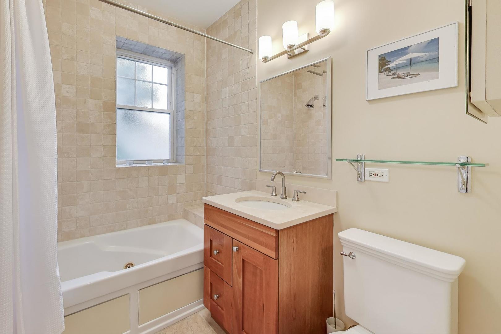 2711 North Mildred Avenue, Unit 3A Chicago, IL 60614 - Photo 19 of 27 a bathroom with a sink a toilet and shower