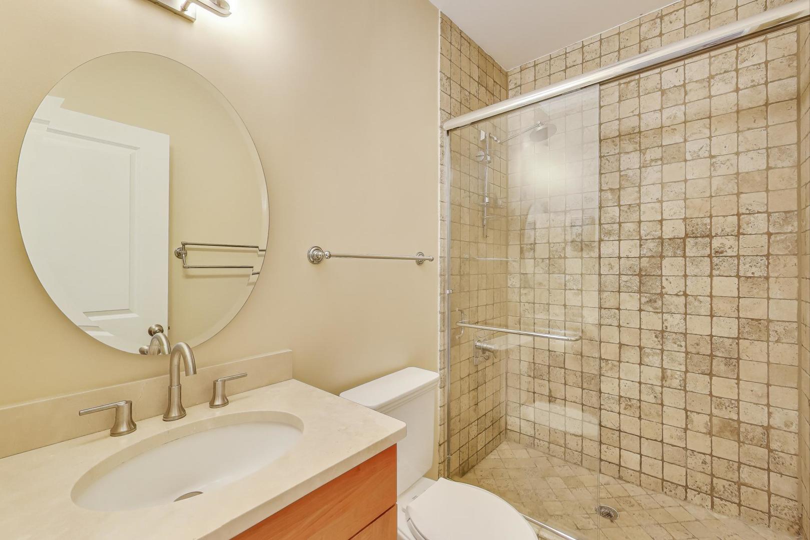 2711 North Mildred Avenue, Unit 3A Chicago, IL 60614 - Photo 22 of 27 a bathroom with a sink toilet and shower