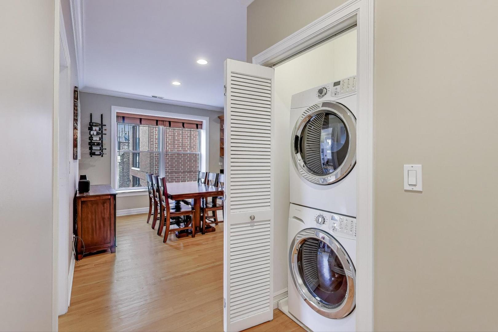 2711 North Mildred Avenue, Unit 3A Chicago, IL 60614 - Photo 23 of 27 a view of a hallway with washer and dryer