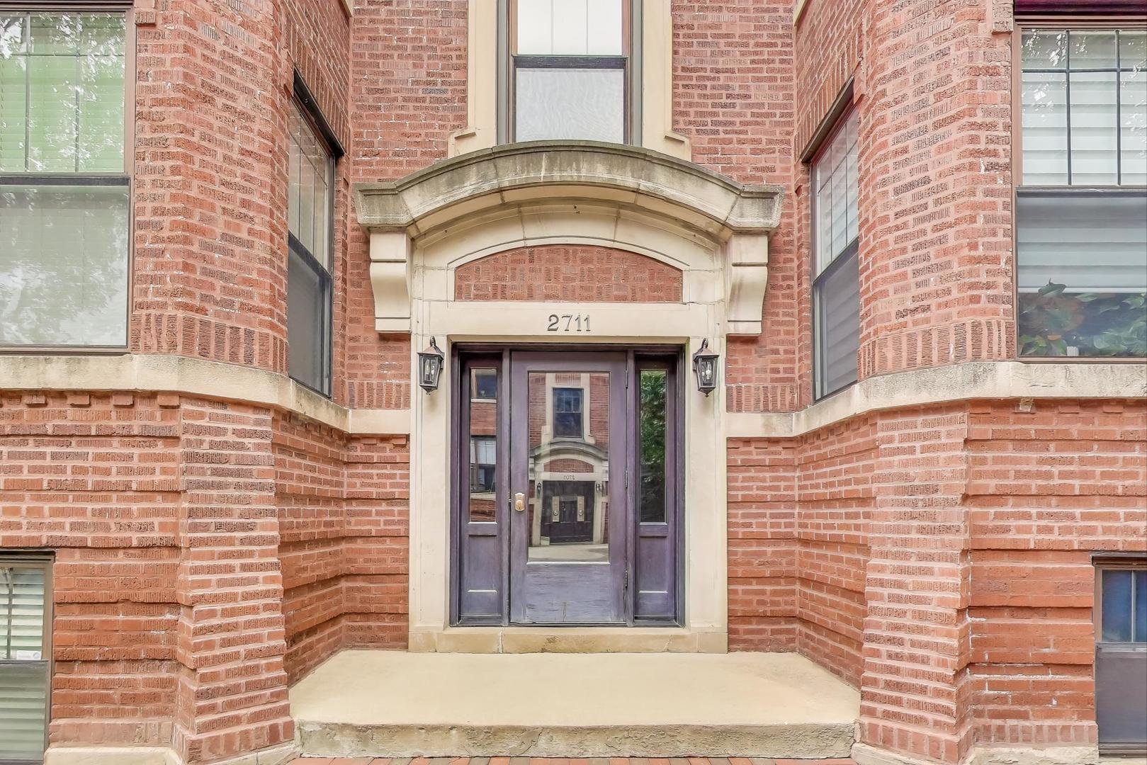 2711 North Mildred Avenue, Unit 3A Chicago, IL 60614 - Photo 3 of 27 a view of a brick building with a large window