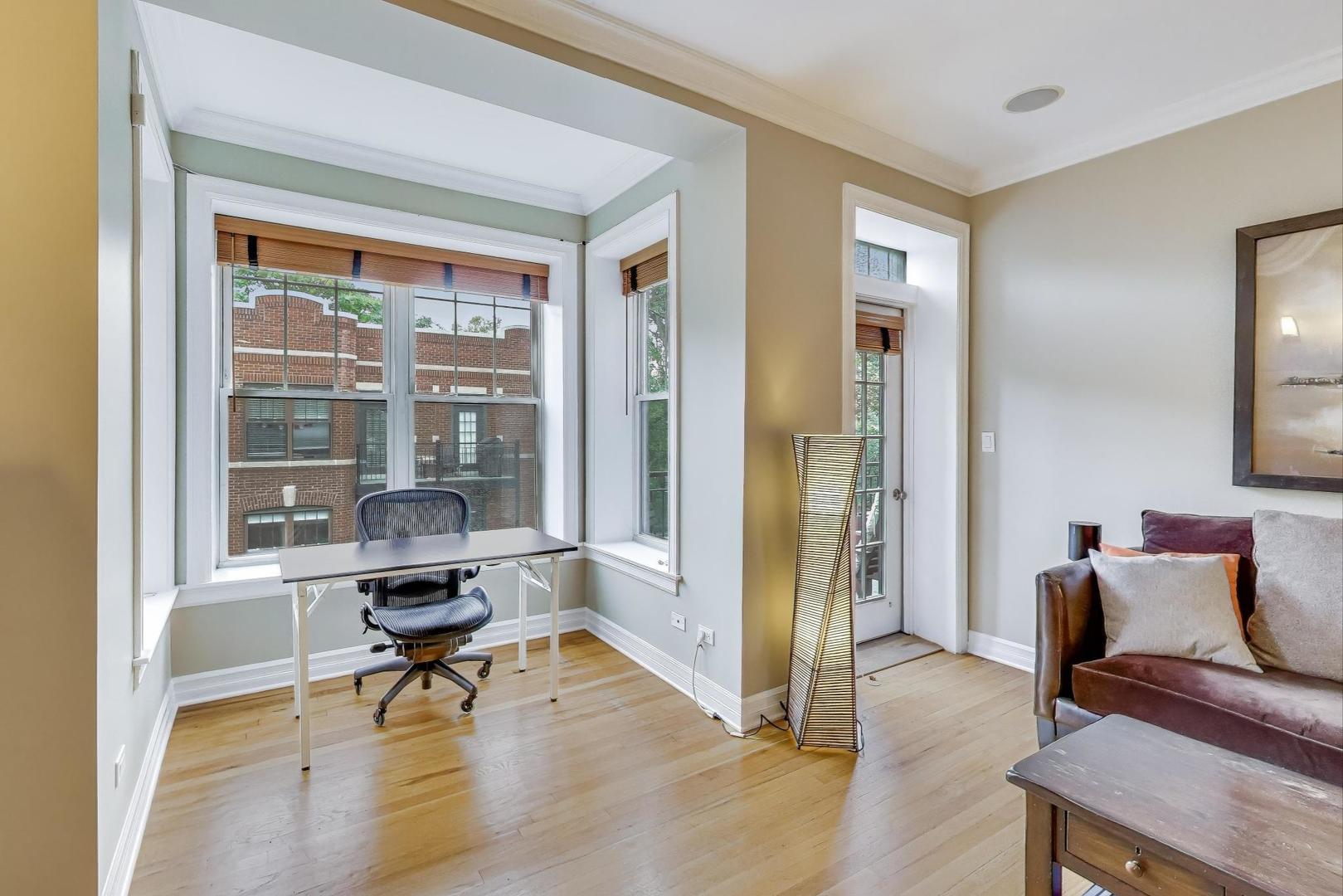 2711 North Mildred Avenue, Unit 3A Chicago, IL 60614 - Photo 8 of 27 a living room with furniture and a floor to ceiling window