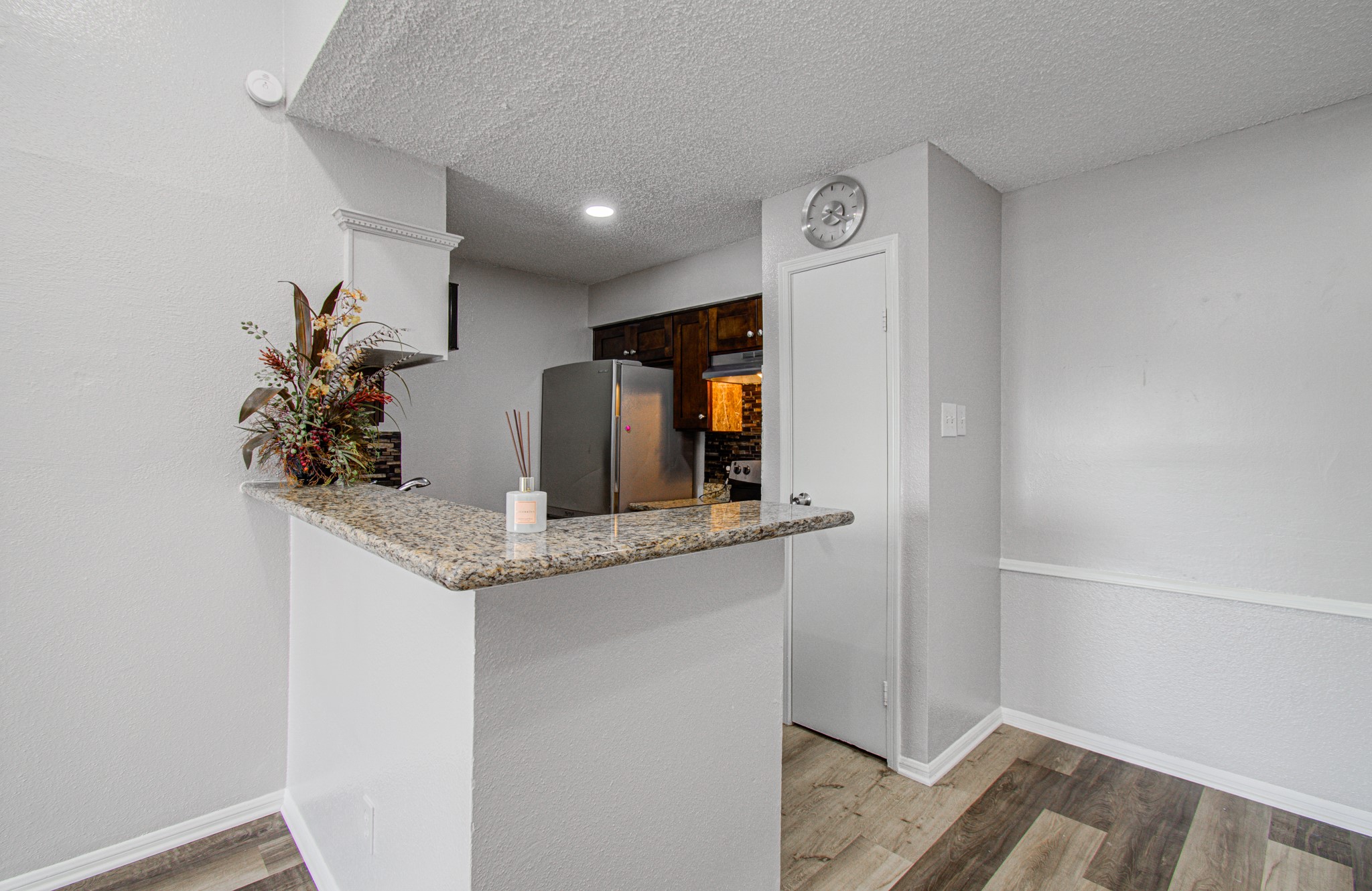 10101 South Gessner Road, Unit 405 Houston, TX 77071 - Photo 13 of 27 a kitchen with stainless steel appliances granite countertop a refrigerator and a sink