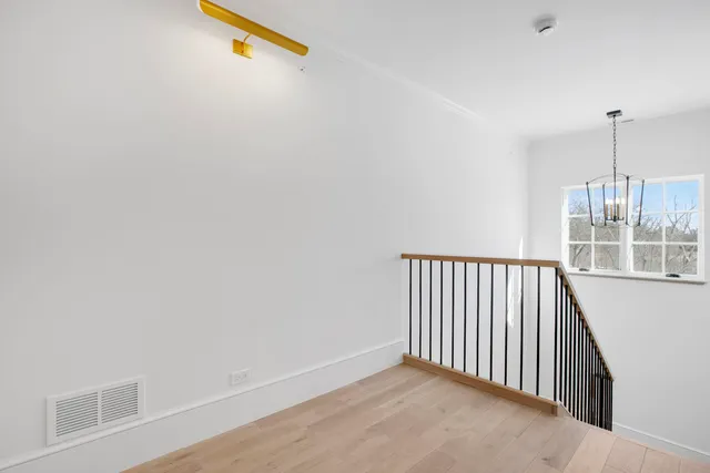 a view of a hallway with windows