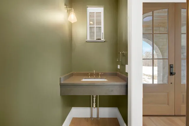 a bathroom with a sink and a mirror