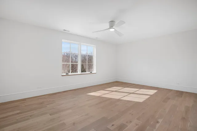 a view of an empty room with windows