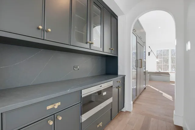 a kitchen with stainless steel appliances granite countertop a stove and a refrigerator