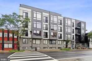 7700 Georgia Avenue Northwest, Unit 4 Washington, DC 20012 - Photo 1 of 8 a front view of a building