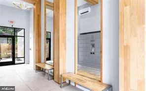 a bathroom with a bathtub and shower