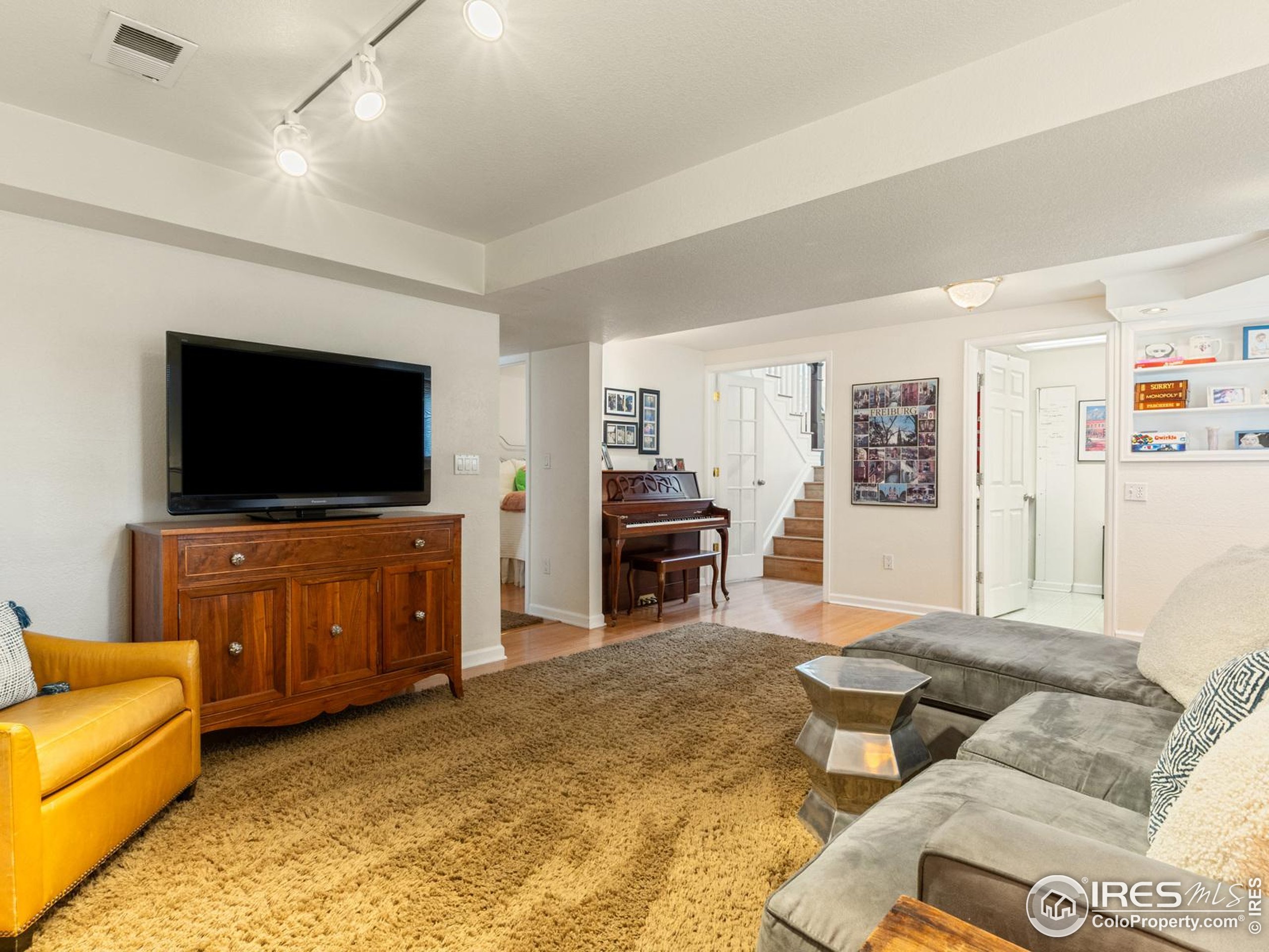 234 Mohawk Drive Boulder, CO 80303 - Photo 29 of 49 a living room with furniture and a flat screen tv