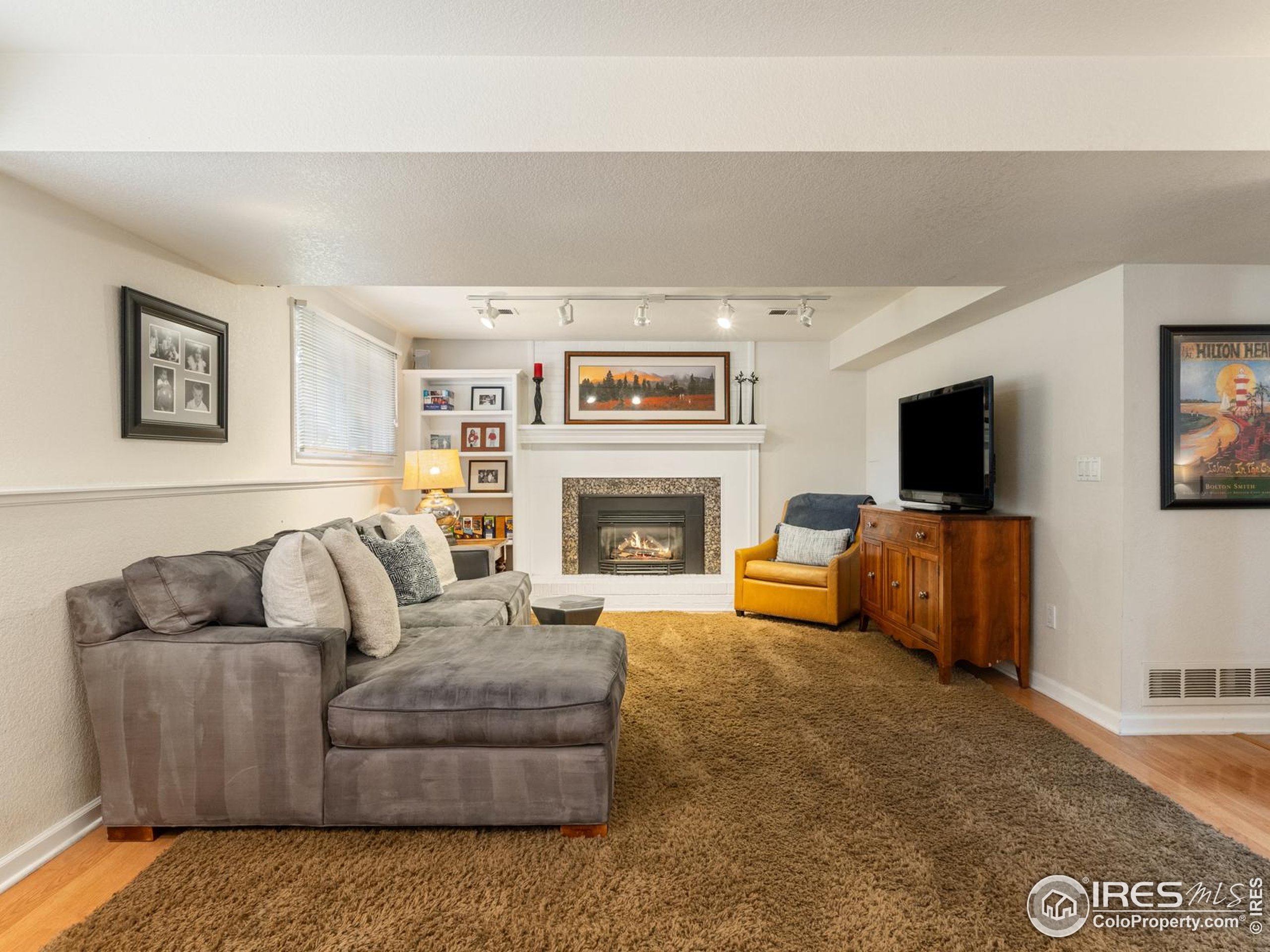 234 Mohawk Drive Boulder, CO 80303 - Photo 30 of 49 a living room with furniture and a flat screen tv