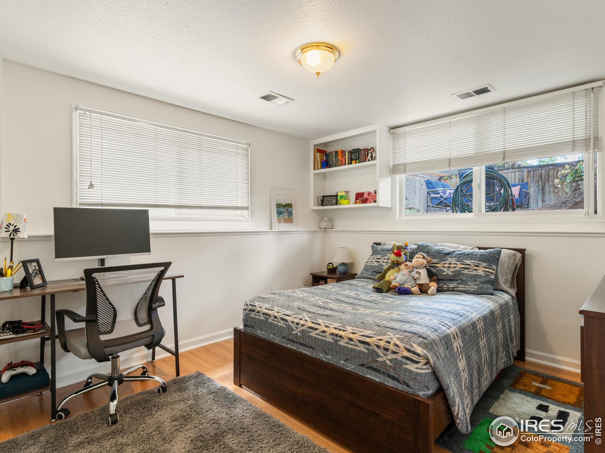234 Mohawk Drive Boulder, CO 80303 - Photo 31 of 49 a bedroom with a bed and a desk