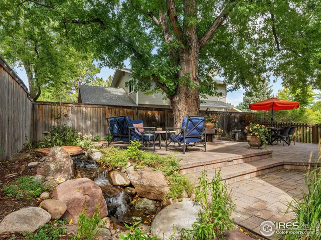 a view of a chair and tables in the garden