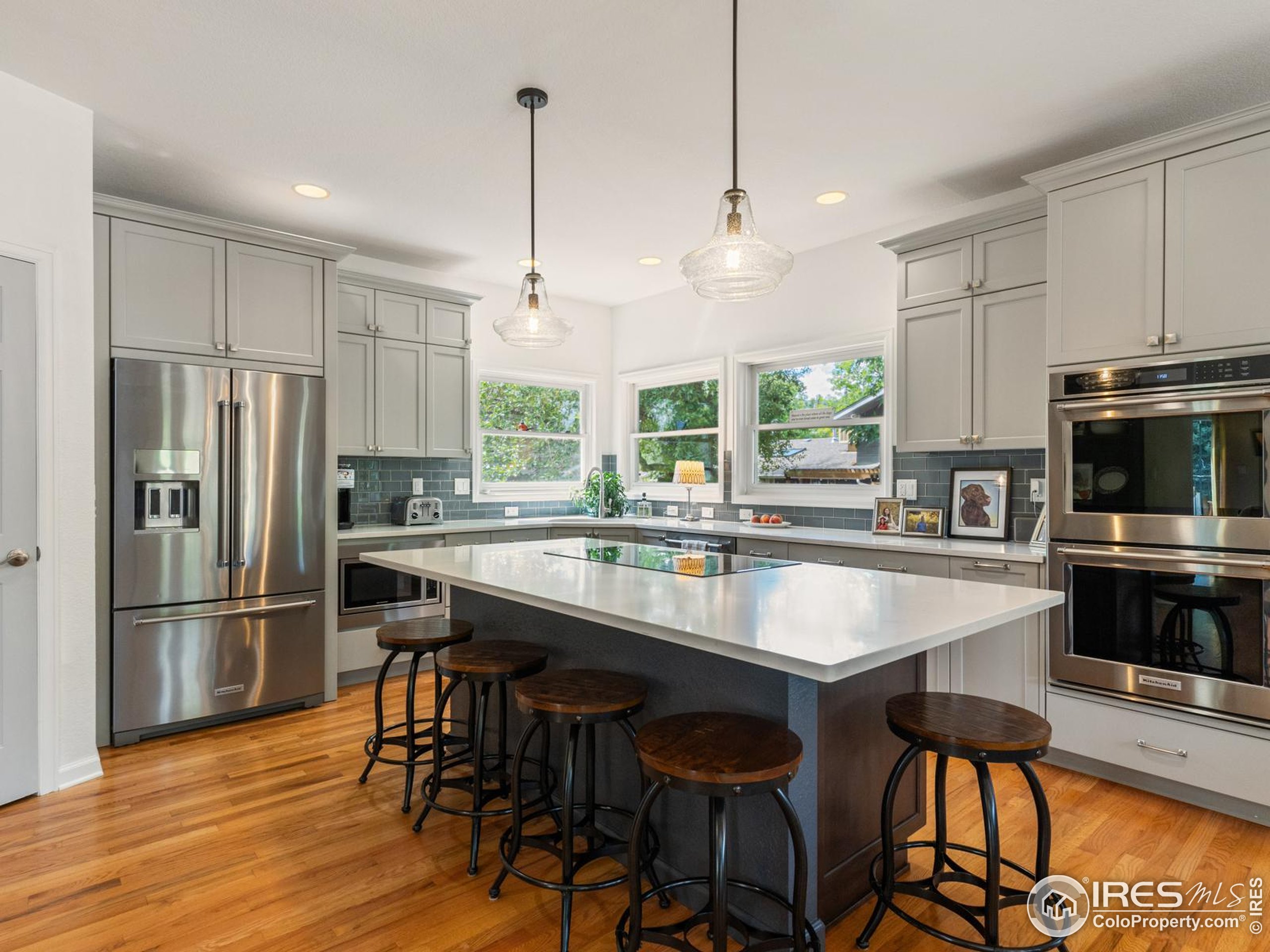 234 Mohawk Drive Boulder, CO 80303 - Photo 5 of 49 a kitchen with stainless steel appliances granite countertop a table chairs stove and refrigerator