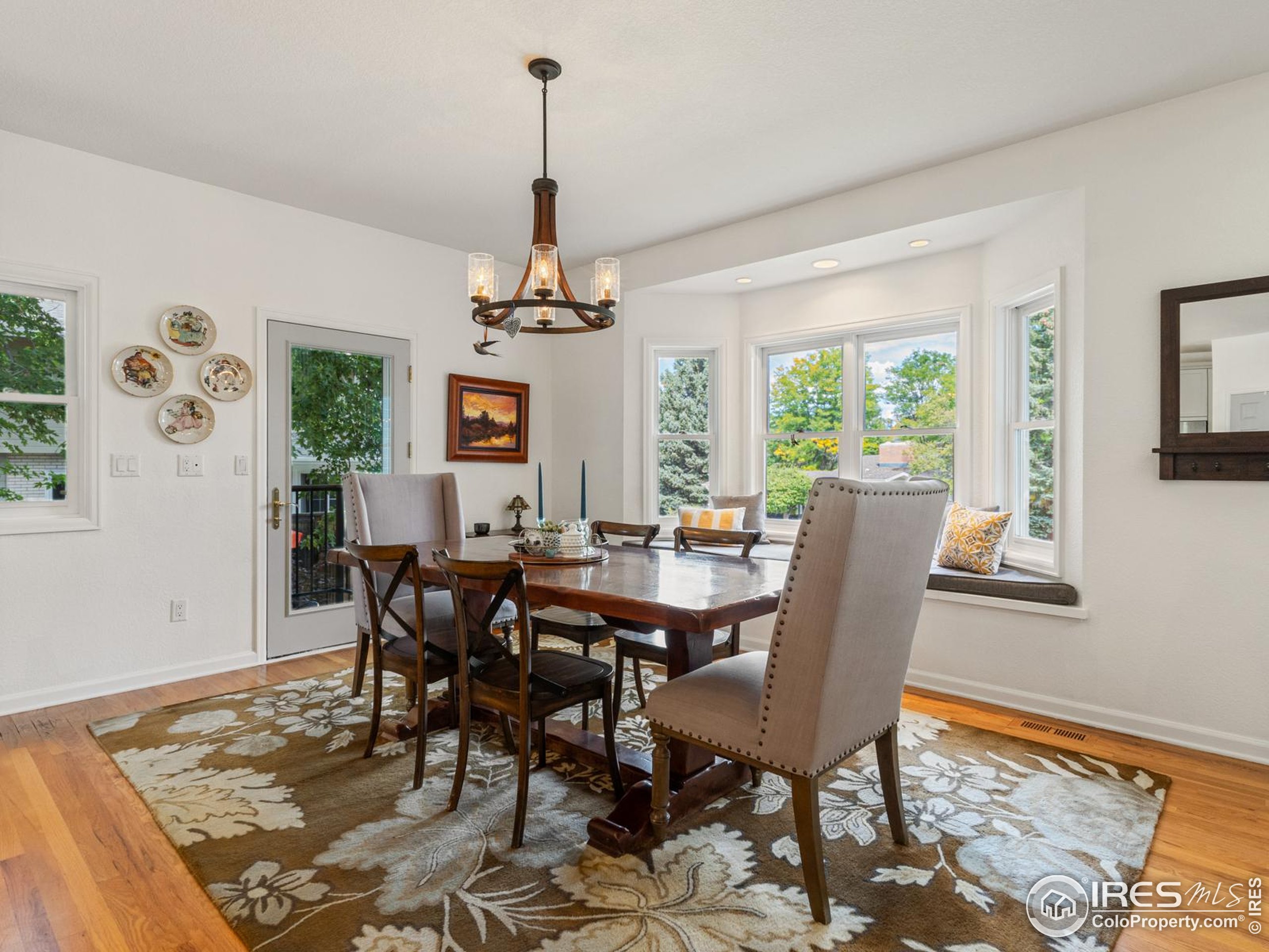 234 Mohawk Drive Boulder, CO 80303 - Photo 8 of 49 a view of a dining room with furniture window and wooden floor