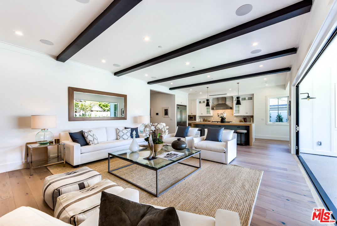 16700 Addison Street Encino, CA 91436 - Photo 17 of 53 a living room with furniture and a rug