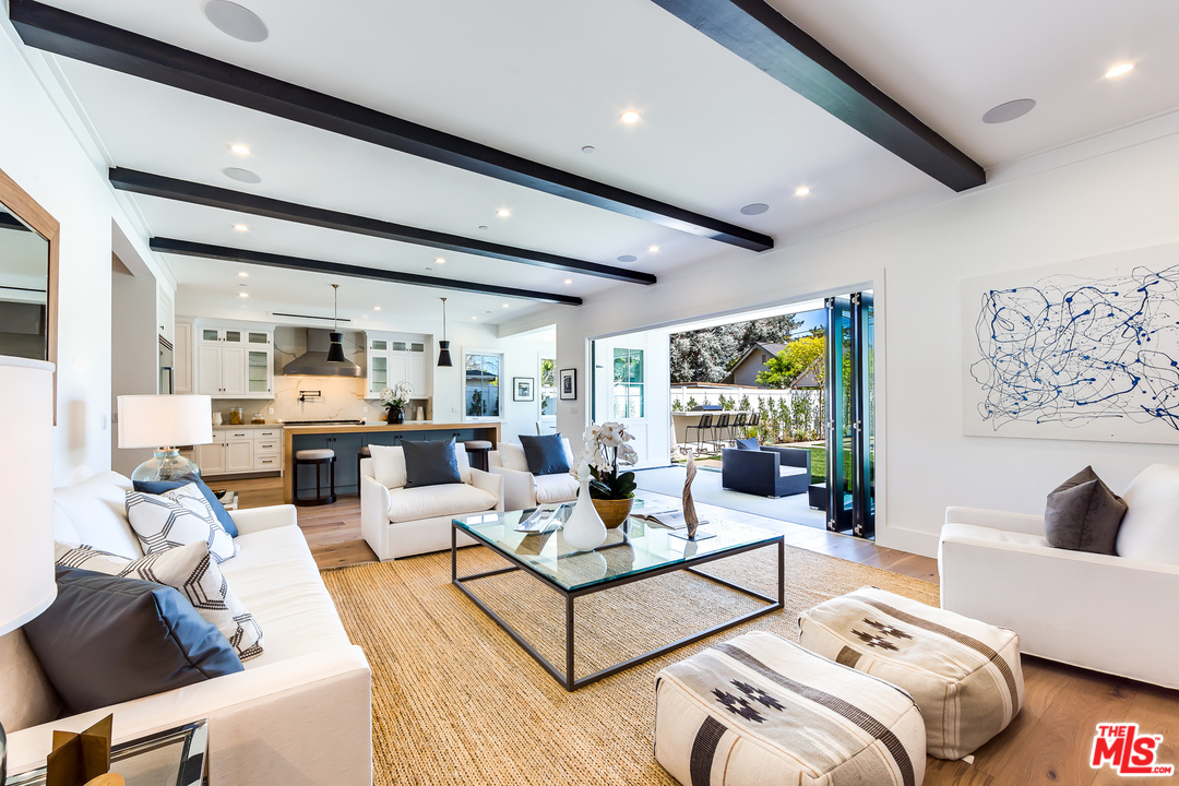16700 Addison Street Encino, CA 91436 - Photo 18 of 53 a living room with furniture and a large window