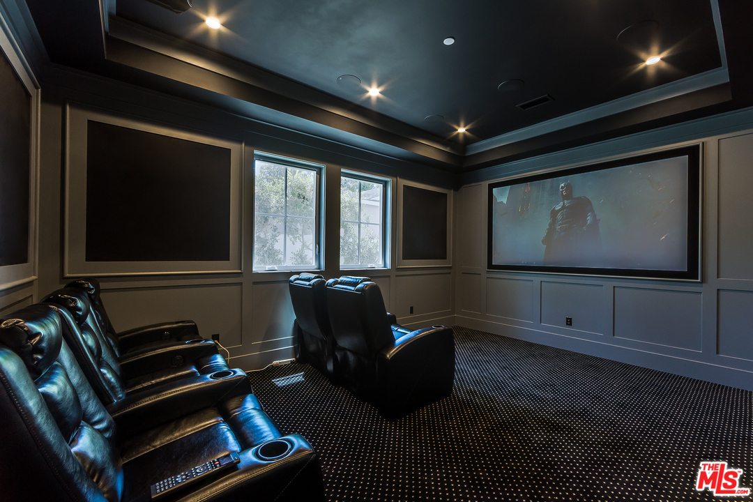 16700 Addison Street Encino, CA 91436 - Photo 21 of 53 a living room with furniture and a flat screen tv