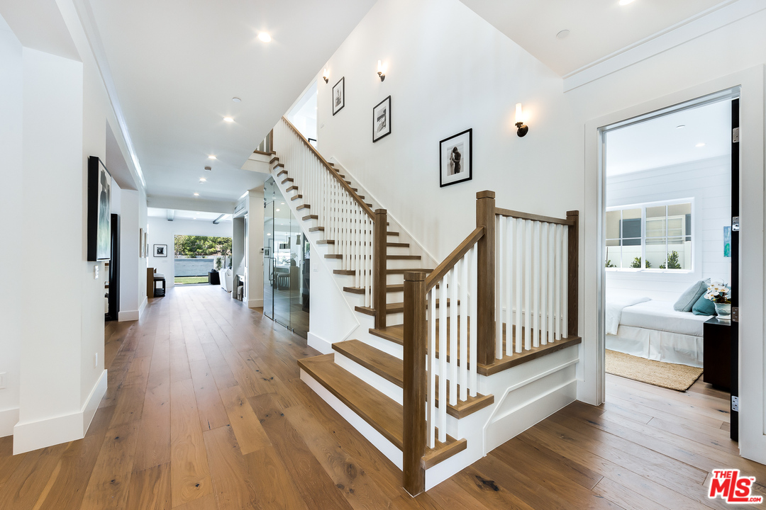 16700 Addison Street Encino, CA 91436 - Photo 27 of 53 a view of entryway and hall with wooden floor