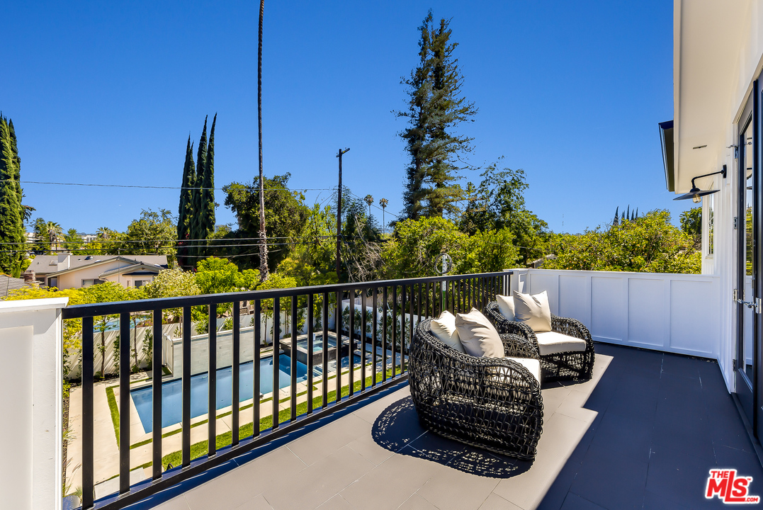 16700 Addison Street Encino, CA 91436 - Photo 34 of 53 a view of a balcony with chairs