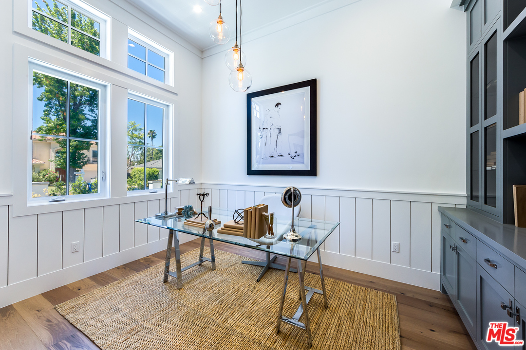 16700 Addison Street Encino, CA 91436 - Photo 5 of 53 a work room with furniture a rug and a window