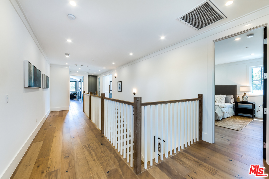16700 Addison Street Encino, CA 91436 - Photo 41 of 53 a view of a living room with a wooden floor