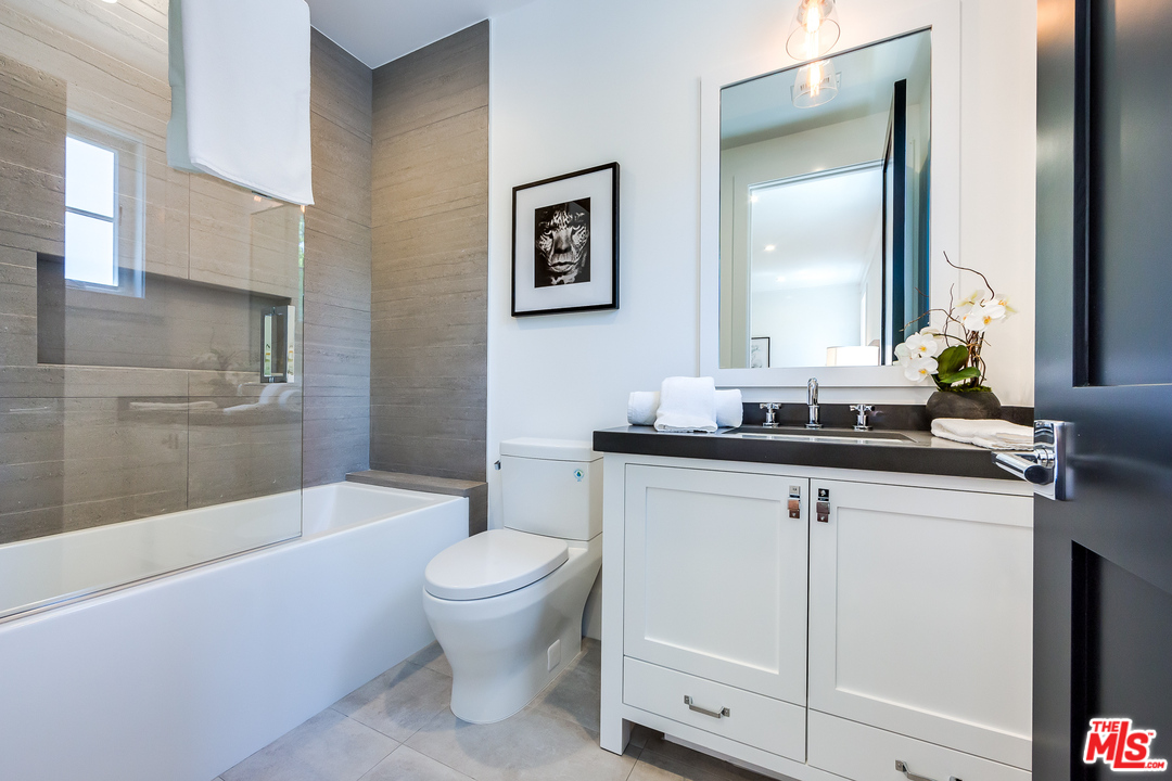 16700 Addison Street Encino, CA 91436 - Photo 43 of 53 a bathroom with a sink a toilet and a bathtub
