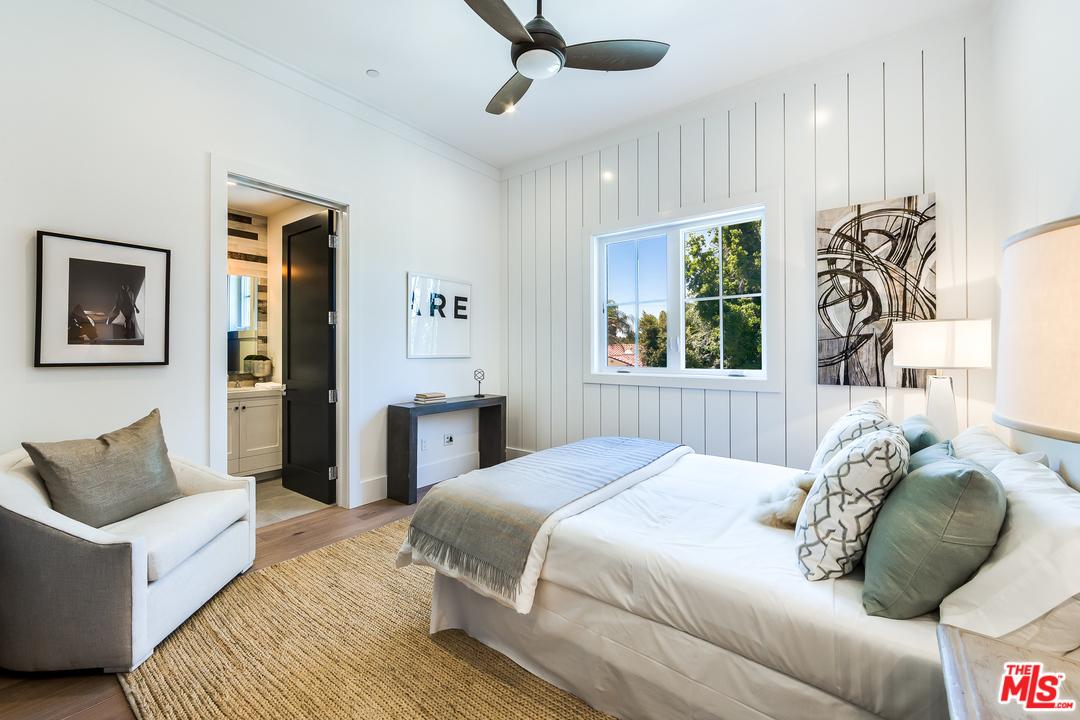 16700 Addison Street Encino, CA 91436 - Photo 44 of 53 a bedroom with a bed and a couch