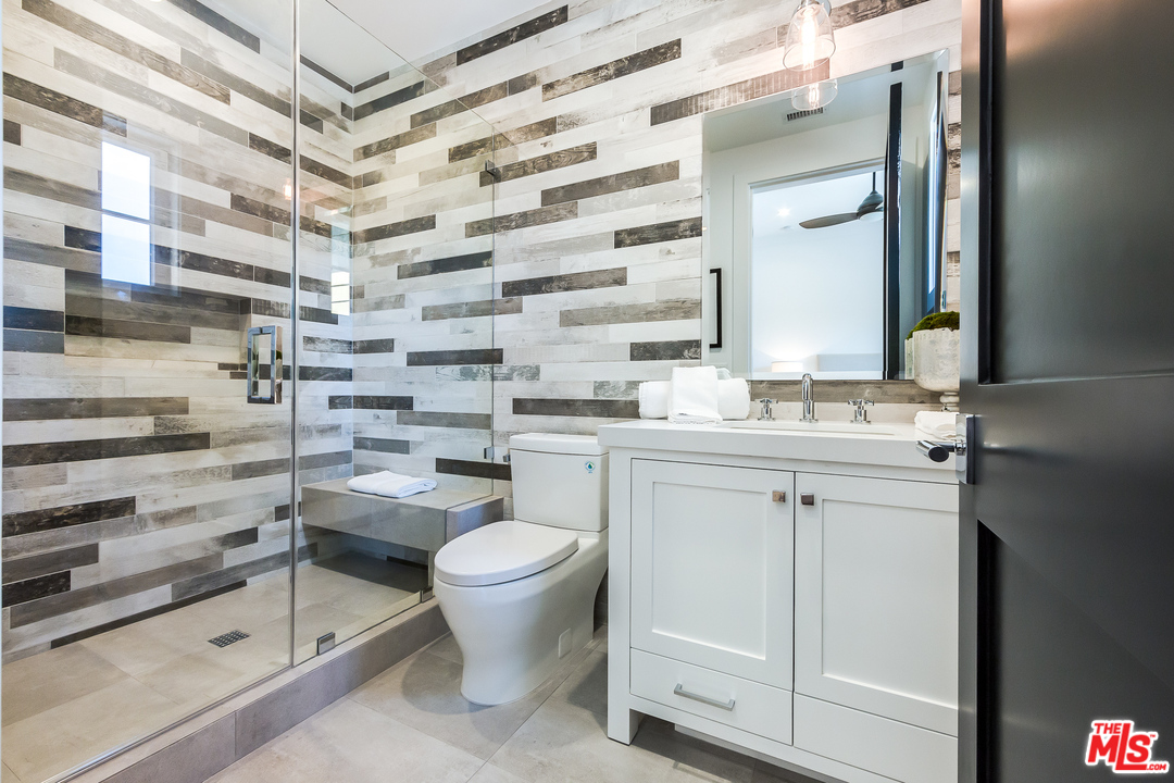 16700 Addison Street Encino, CA 91436 - Photo 45 of 53 a bathroom with a sink toilet and shower