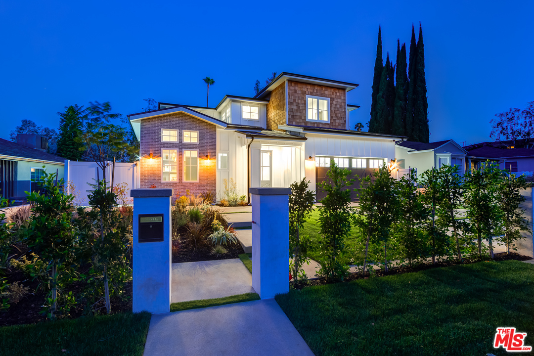 16700 Addison Street Encino, CA 91436 - Photo 53 of 53 a front view of a house with a yard