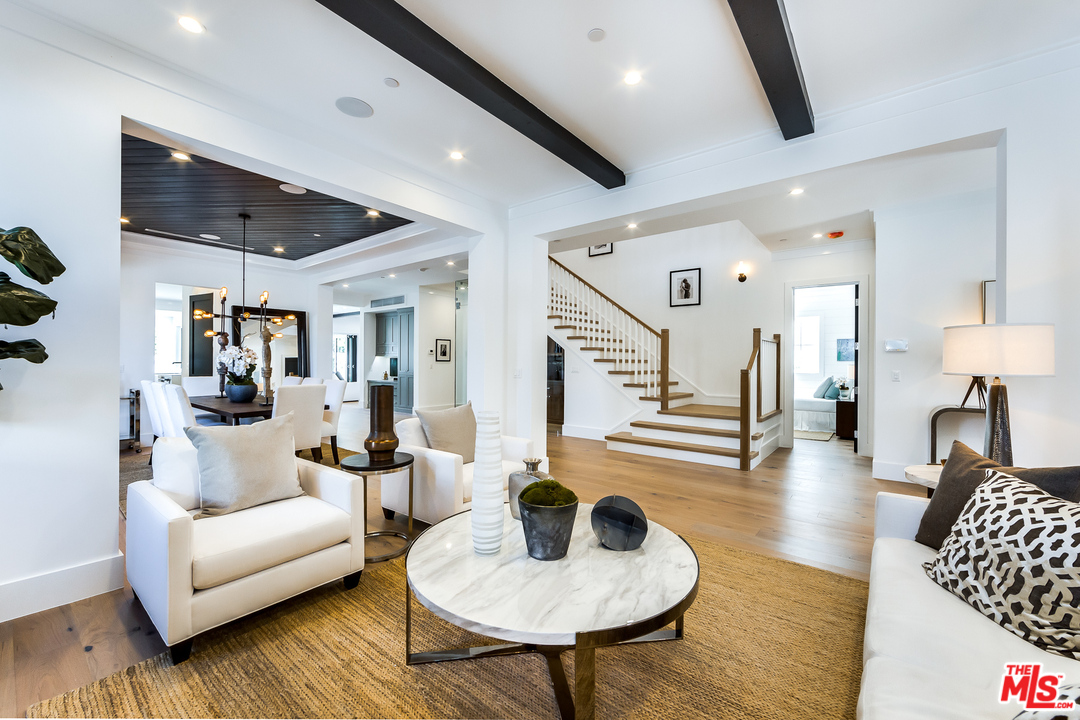 16700 Addison Street Encino, CA 91436 - Photo 9 of 53 a living room with furniture and a wooden floor
