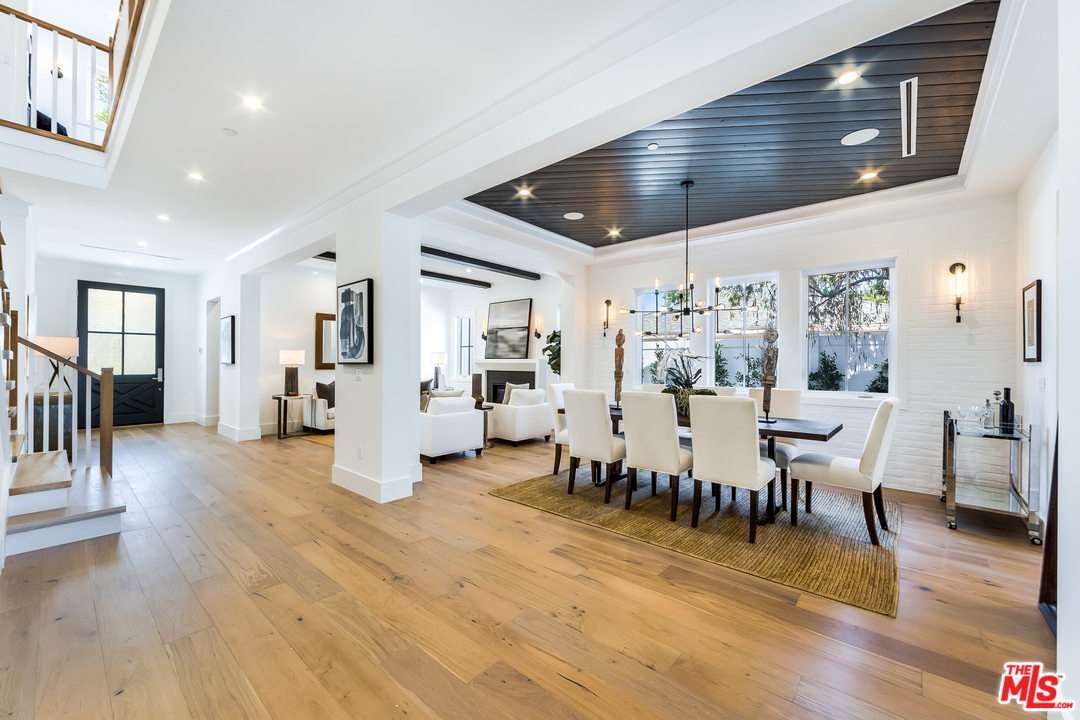 16700 Addison Street Encino, CA 91436 - Photo 10 of 53 a living room with furniture and wooden floor