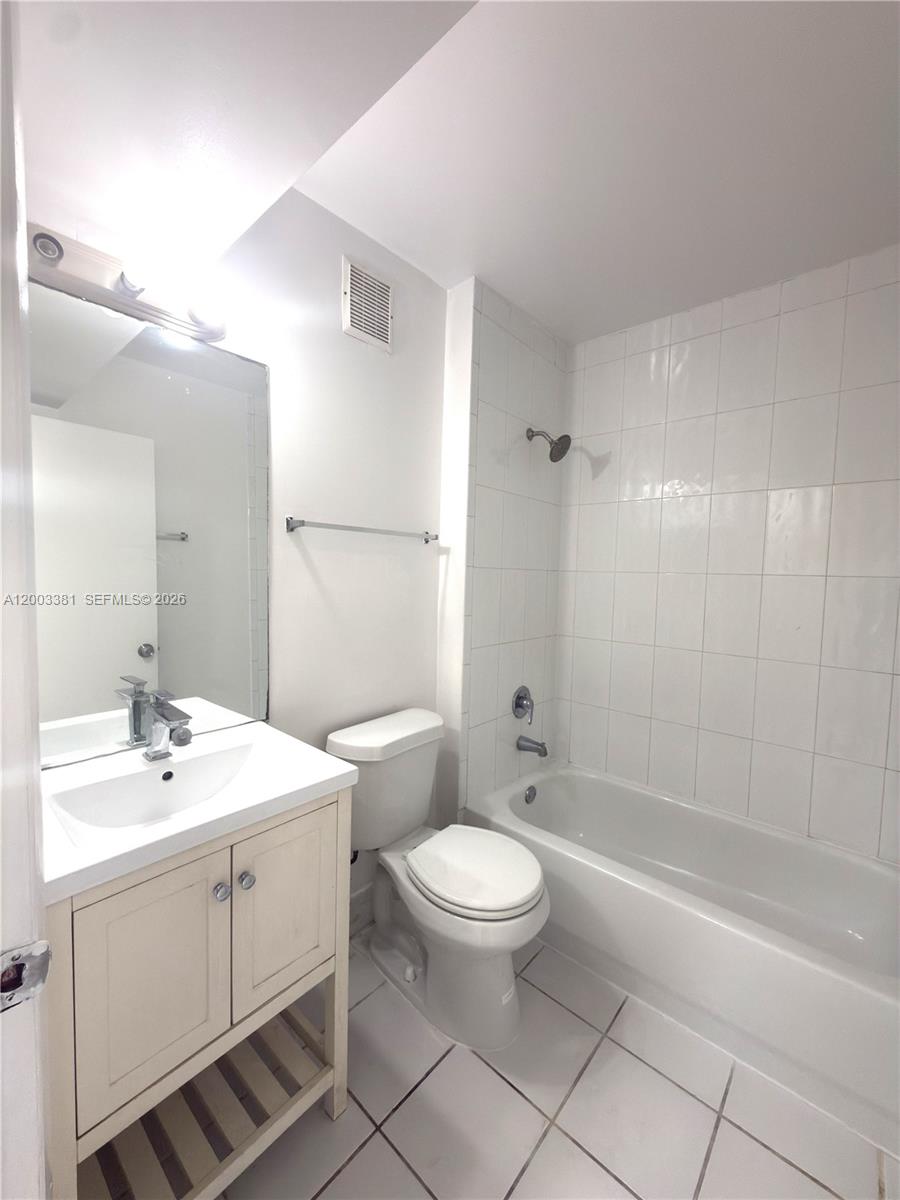 14020 Northeast 3rd Court, Unit 5 Miami, FL 33161 - Photo 4 of 19 downstirs bathroom