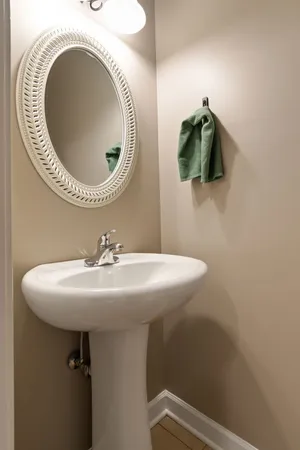 a bathroom with a sink and mirror