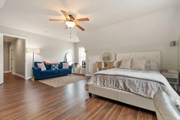 a bedroom with a bed and window