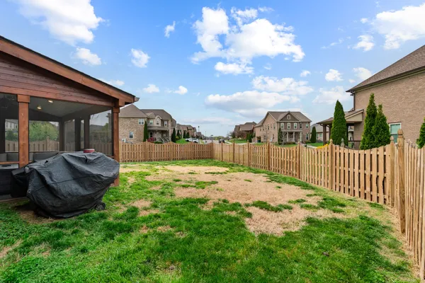 a view of a backyard with porch