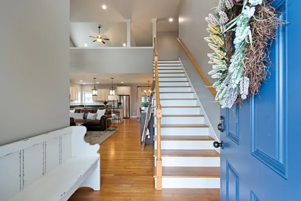 a view of entryway and hall with wooden floor