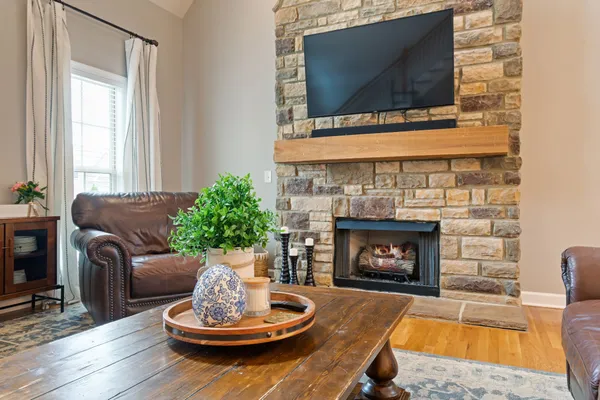 a living room with furniture and a fireplace