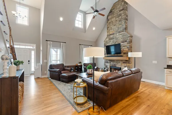 a living room with furniture and a fireplace
