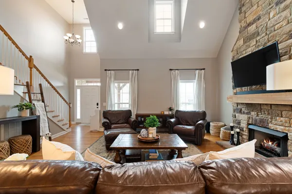a living room with furniture and a fireplace